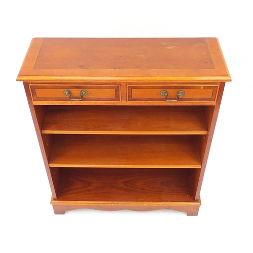 113 - Inlaid yew bookcase, with two drawers, above two adjustable shelves, 92cm H x 76cm W x 27cm D