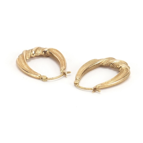 2657 - Two pairs of 9ct gold hoop earrings, the largest 3.2cm in diameter, approximate weight 3.4g