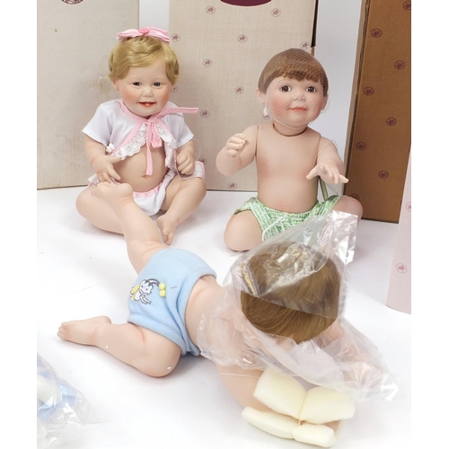 2217 - Seven Ashton Drake porcelain dolls including Snug as a Bug in a Rug, It's a Girl and Pretty as a Pic... 