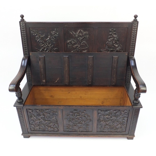 2023 - Oak Settle with floral carved panels and lift up seat, 122cm H x 123cm W x 46cm D