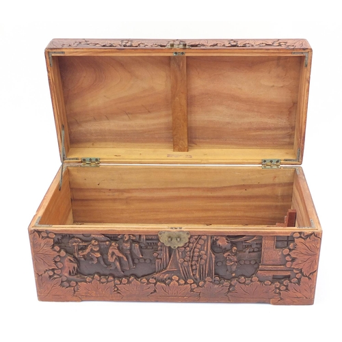 28 - Camphorwood chest carved with figures and buildings, 35cm H x 73cm W x 36cm D