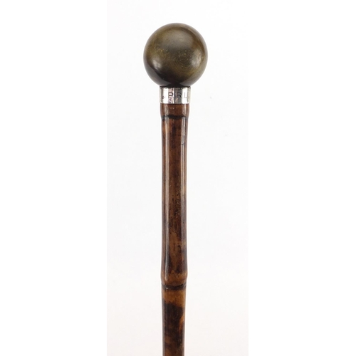 91 - Bamboo walking stick with horn pommel and silver collar by Brigg of London, the pommel possibly rhin... 