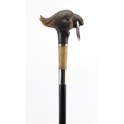 93 - Carved horn cocktoo design walking stick with ebonised shaft, the carved pommel possibly rhinoceros ... 