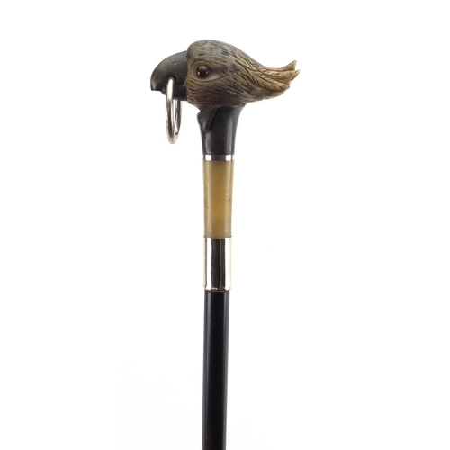 93 - Carved horn cocktoo design walking stick with ebonised shaft, the carved pommel possibly rhinoceros ... 