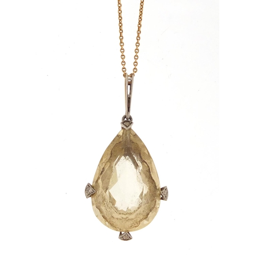 584 - Unmarked gold citrine and diamond tear drop pendant on an unmarked gold necklace, the pendant 4.2cm ... 
