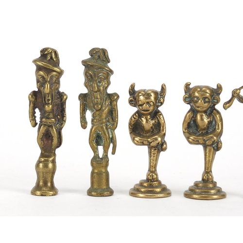 58 - Five antique pipe tampers comprising two devil and three figural design examples, the largest 7cm hi... 