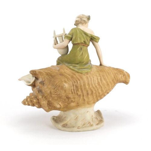 477 - Royal Dux centre piece of a maiden playing a harp seated on a shell, factory marks and numbered 1932... 
