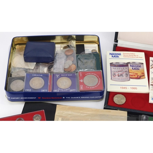 620 - British coins and presentation stamps packs including commemorative crowns and uncirculated coin set... 