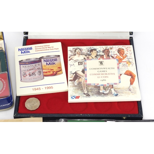 620 - British coins and presentation stamps packs including commemorative crowns and uncirculated coin set... 
