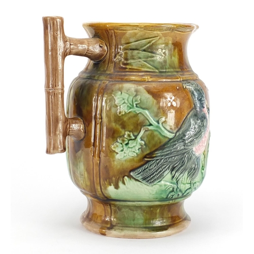 243 - Victorian Majolica jug decorated in relief with birds, 23cm high