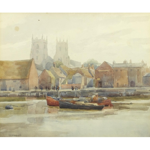 2482 - Moored boats before a town, watercolour, bearing a signature L G Walpole,  mounted and framed, 36.5c... 