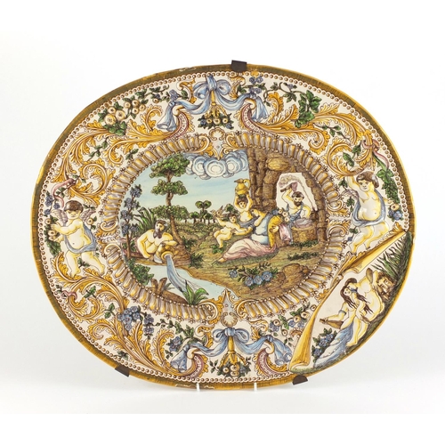 426 - Antique Italian Maiolica charger decorated in relief and hand painted with classical figures, inscri... 