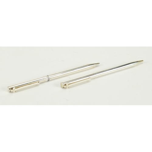 82 - Tiffany & Co silver propelling pencil and ball point pen, housed in a fitted case with box