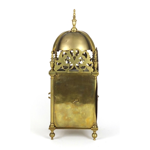 711 - 17th century style brass lantern clock striking on a bell, the dial with Roman numerals, 39.5cm high