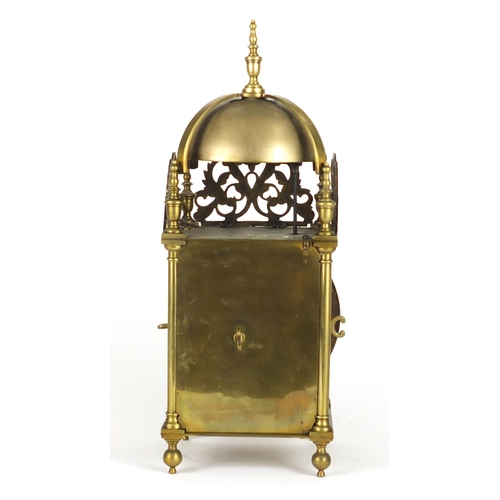 711 - 17th century style brass lantern clock striking on a bell, the dial with Roman numerals, 39.5cm high