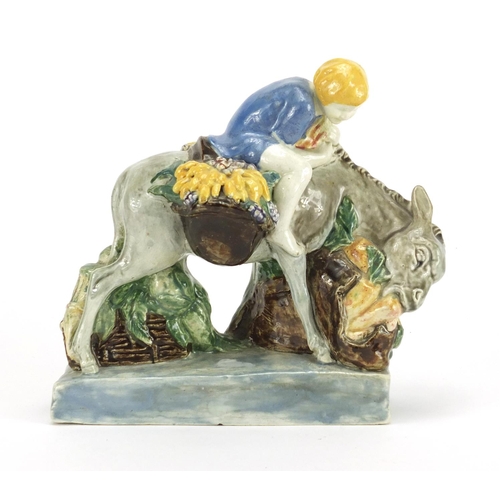 471 - Stella R Crofts hand painted pottery model of a figure on donkey, 18.5cm high