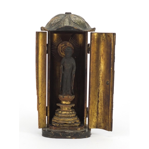 333 - Asian partially gilt lacquered wood buddha, housed in a case, 29cm high