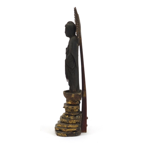 333 - Asian partially gilt lacquered wood buddha, housed in a case, 29cm high