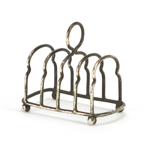 527A - Victorian miniature silver four slice toast rack by Haseler Brothers, Chester 1902, 7.2cm in length,... 