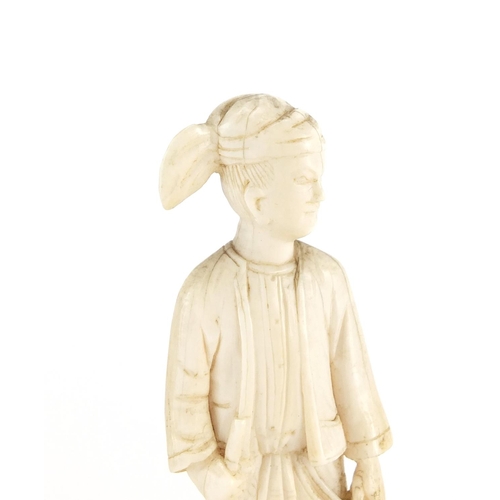 642 - Two Indian carved ivory figures, raised on wooden bases, the largest 19cm high