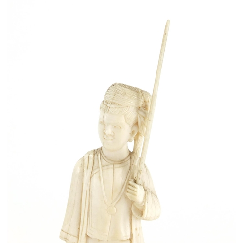 642 - Two Indian carved ivory figures, raised on wooden bases, the largest 19cm high
