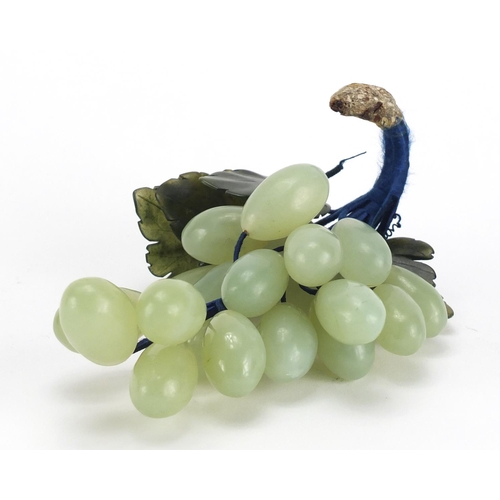 697 - Carved jade bunch of grapes on vine, 18cm in length
