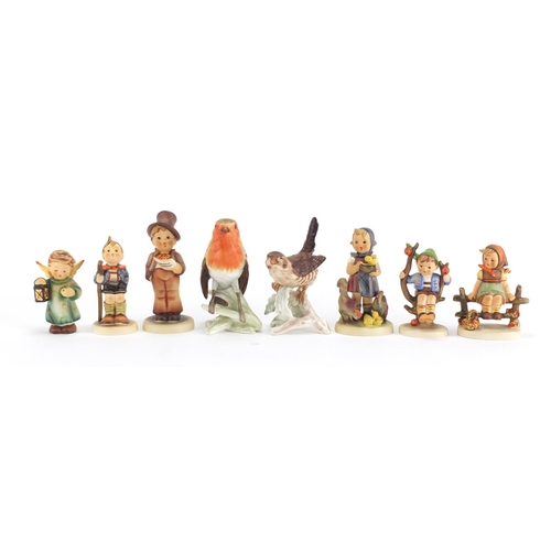 2244 - Goebel figures and birds including a boy on a tree, the largest 13cm high