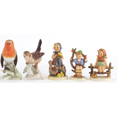 2244 - Goebel figures and birds including a boy on a tree, the largest 13cm high
