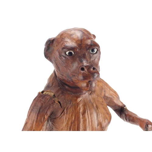 2312 - Victorian leather monkey with beaded glass eyes, 36cm high