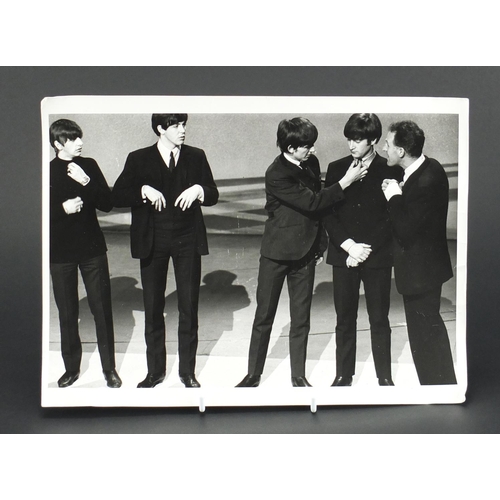 115 - Vintage black and white photograph of The Beatles on stage, 30.5cm x 22cm