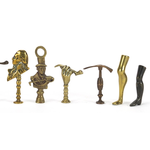 66 - Ten  antique pipe tampers including John Peel, Leg and hand design examples, the largest 8cm high