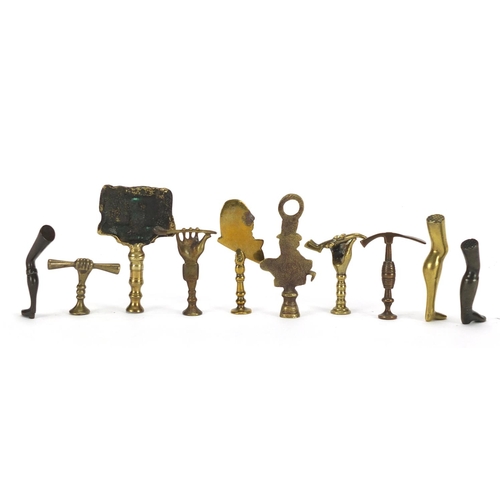 66 - Ten  antique pipe tampers including John Peel, Leg and hand design examples, the largest 8cm high