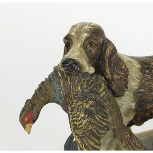 23 - Austrian cold painted table lighter in the form of a spaniel with its prey, 25cm wide