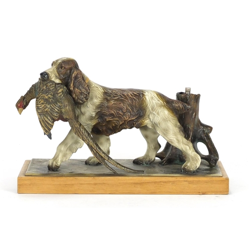 23 - Austrian cold painted table lighter in the form of a spaniel with its prey, 25cm wide