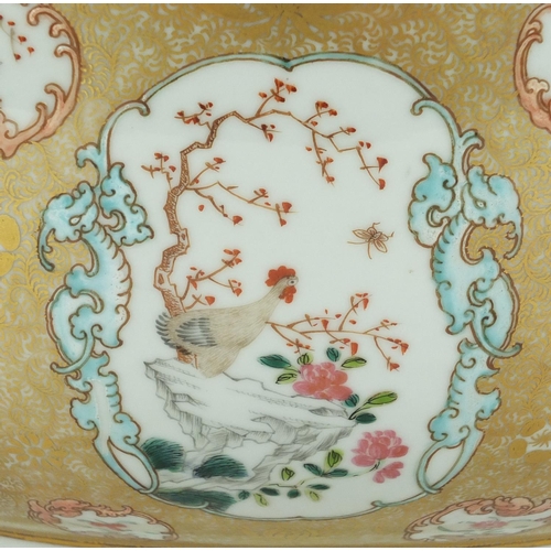 180 - Chinese porcelain punch bowl, finely hand painted in the famille rose palette with panels of figures... 