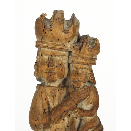 11 - 14th/15th century limewood carving of Madonna and child, raised on a rectangular mahogany block base... 