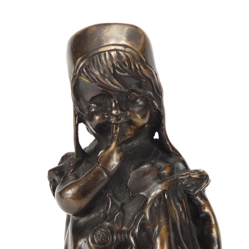 2288 - Patinated bronze figure of a young girl standing on a stool, 30cm high