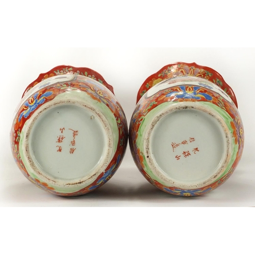 278A - Pair of Japanese Arita porcelain vases with twin handles, each hand painted with figures and flowers... 