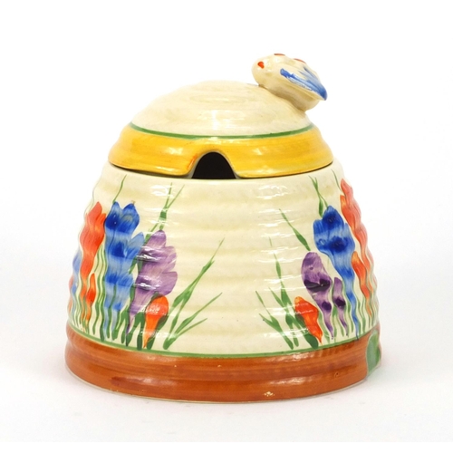 460 - Clarice Cliff Bizarre pottery jam pot and cover, hand painted in the Crocus pattern, 10cm high