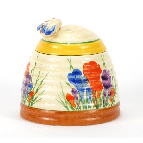 460 - Clarice Cliff Bizarre pottery jam pot and cover, hand painted in the Crocus pattern, 10cm high