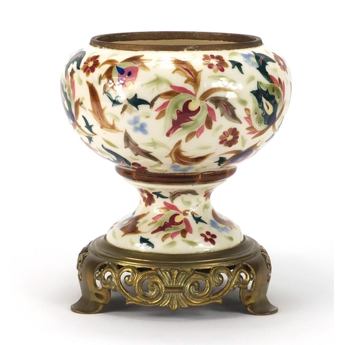 483 - Hungarian oil lamp base by Zsolnay Pecs, the base hand painted with stylised flowers raised on a cas... 