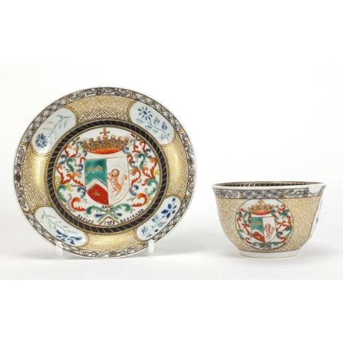 204 - Chinese porcelain armorial tea bowl and saucer hand painted with crests and flowers, the tea bowl 7.... 