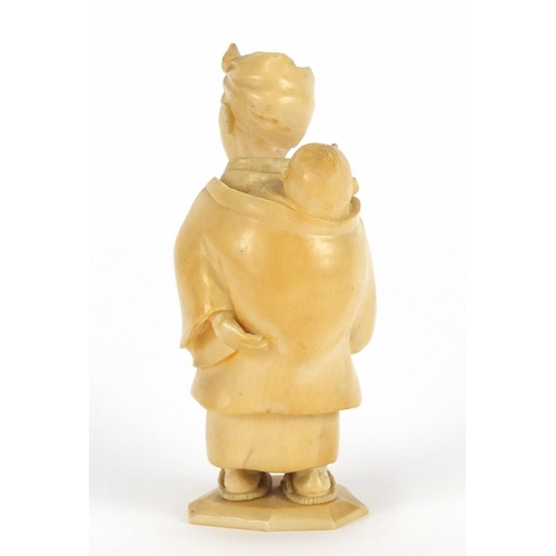 326 - Japanese carved ivory Okimono of a mother and child, 8cm high