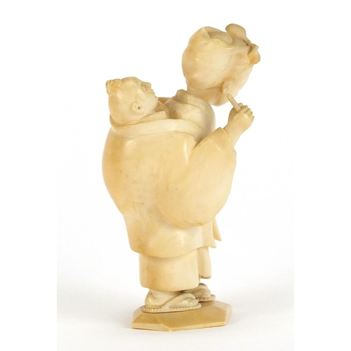 326 - Japanese carved ivory Okimono of a mother and child, 8cm high