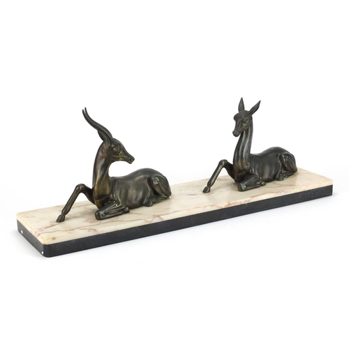 496 - Art Deco marble sculpture mounted with two bronze deer, 55cm wide