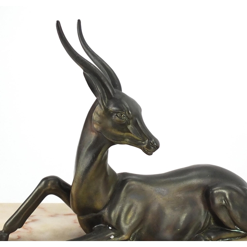 496 - Art Deco marble sculpture mounted with two bronze deer, 55cm wide