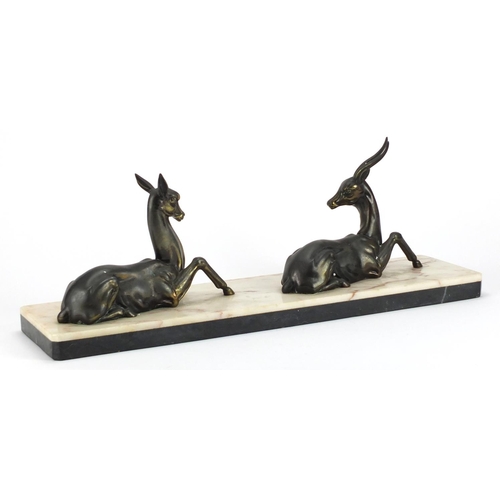 496 - Art Deco marble sculpture mounted with two bronze deer, 55cm wide