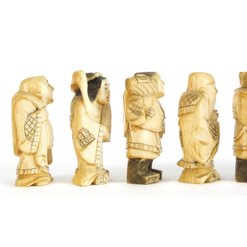 323 - Seven Japanese carved ivory Okimono's including two of farmers, one with character marks to the base... 