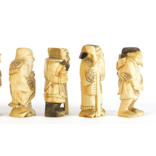 323 - Seven Japanese carved ivory Okimono's including two of farmers, one with character marks to the base... 