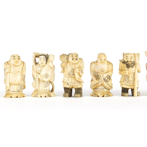 323 - Seven Japanese carved ivory Okimono's including two of farmers, one with character marks to the base... 